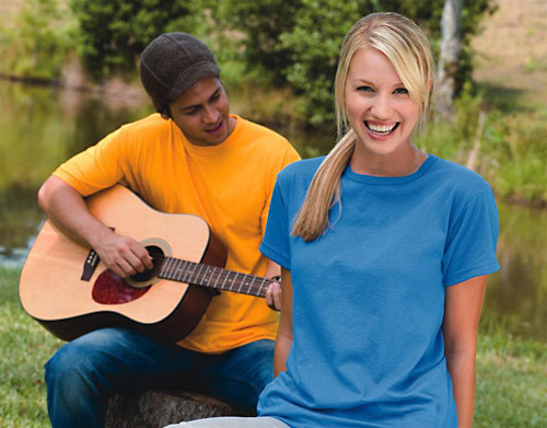 A man playing the guitar and a woman smiling