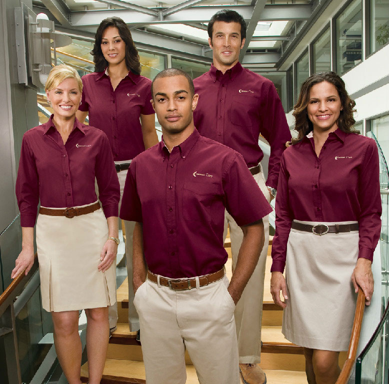 Five people wearing maroon collared tops with their company name embroidered on the chest